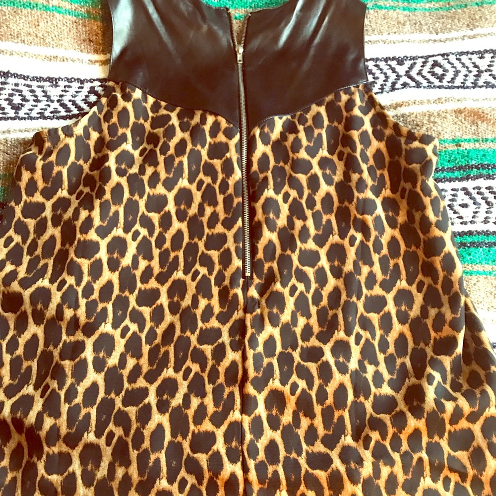 Cheetah print, pleather straps, half zip back. L